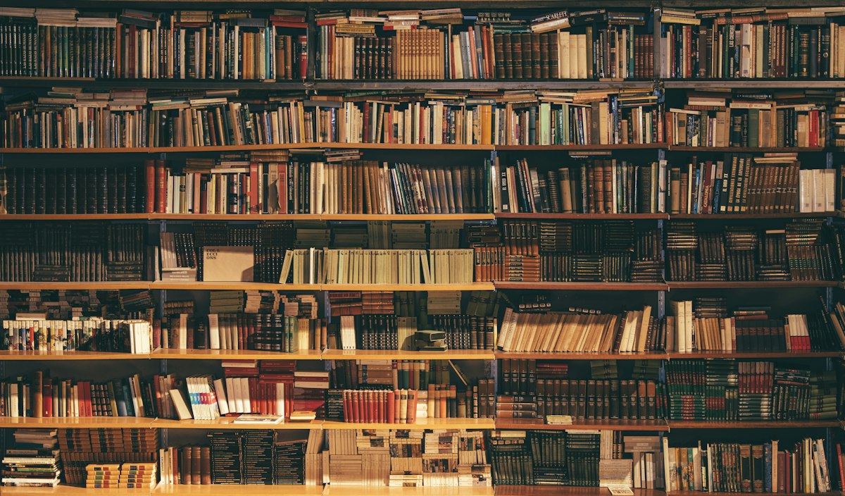 Grand library hall with books — BookSlip reading inspiration